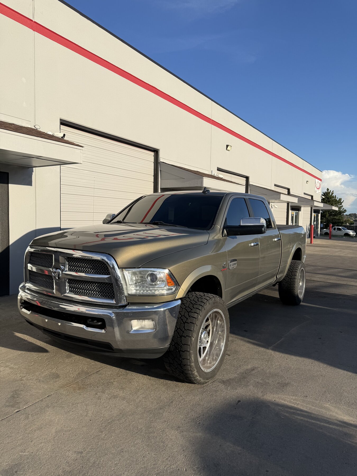 Green Ram 2500 with dark window tint installed by Tinty in Arvada, Colorado